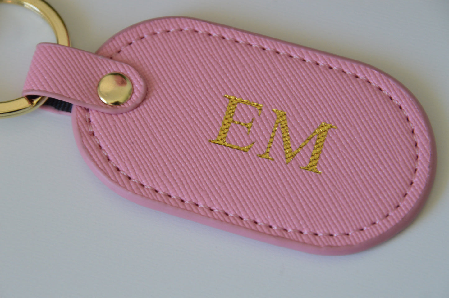 MONOGRAMMED OVAL BABY PINK LEATHER KEYRING