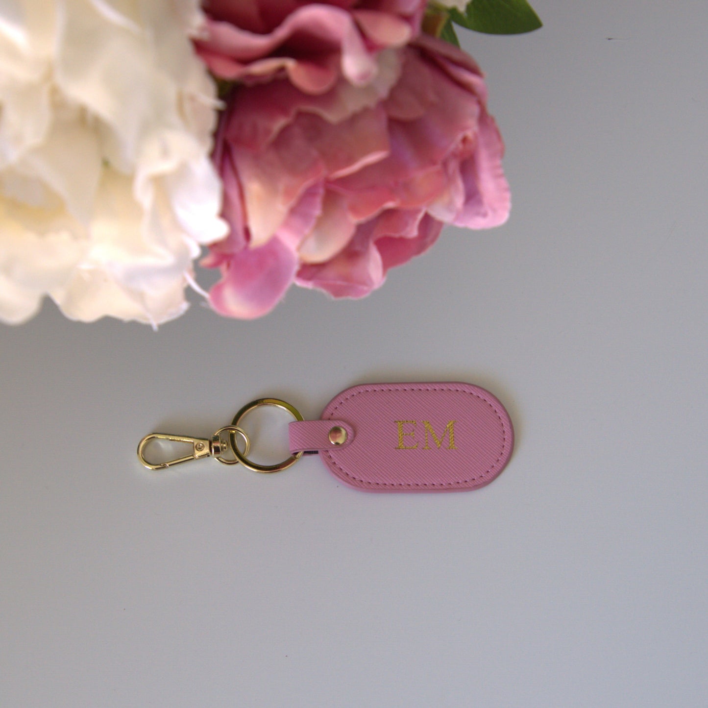 MONOGRAMMED OVAL BABY PINK LEATHER KEYRING