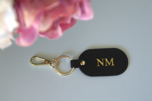 MONOGRAMMED OVAL BLACK LEATHER KEYRING