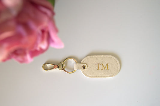 MONOGRAMMED OVAL IVORY LEATHER KEYRING